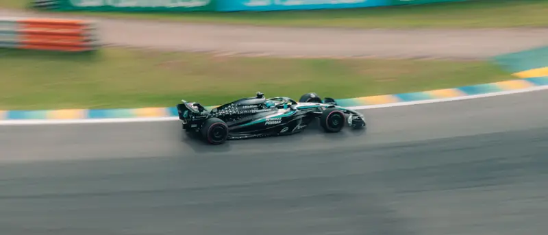 A car at speed, blurred by the pan